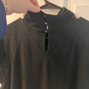 Black lightweight mock neck flutter sleeve shirt